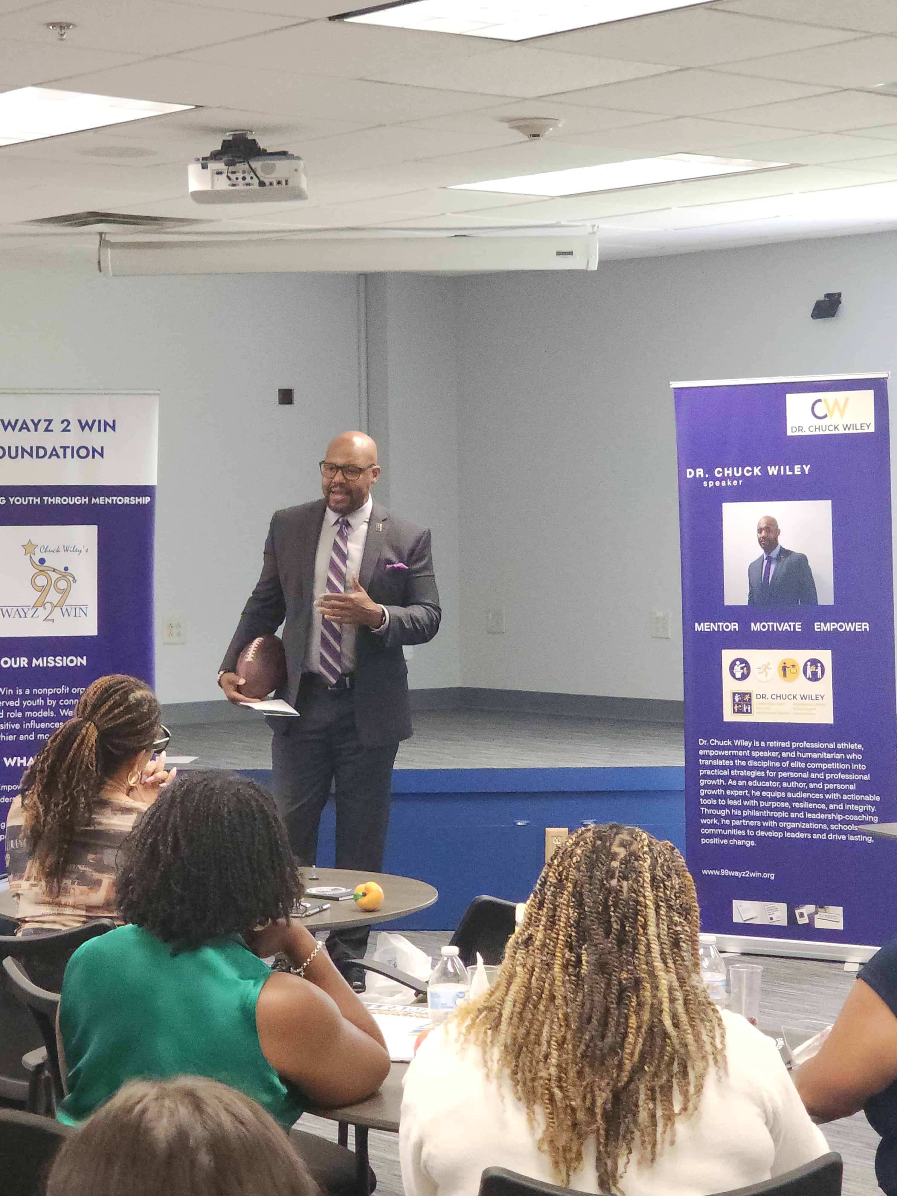 Chuck Wiley presenting to a room of people