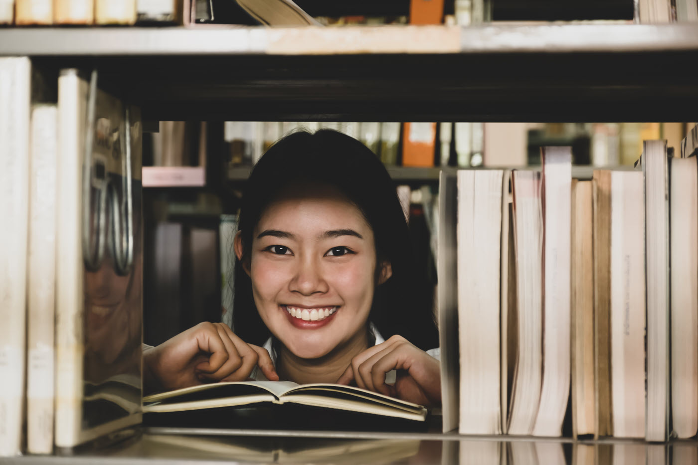 image of woman looking at books