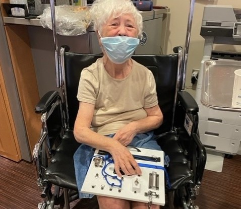 Elderly woman in hospital with a dementia engagement kit