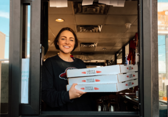 Red Zeppelin employee at take-out window.