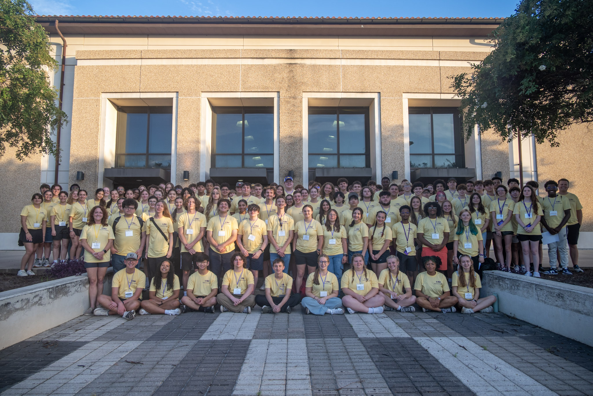 students posing for a photo in the greek theater