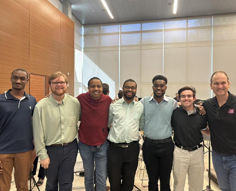 photo of LSU composition students with the music director of the Civic Orchestra of Baton Rouge