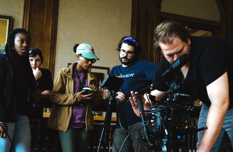 Image of students working on film