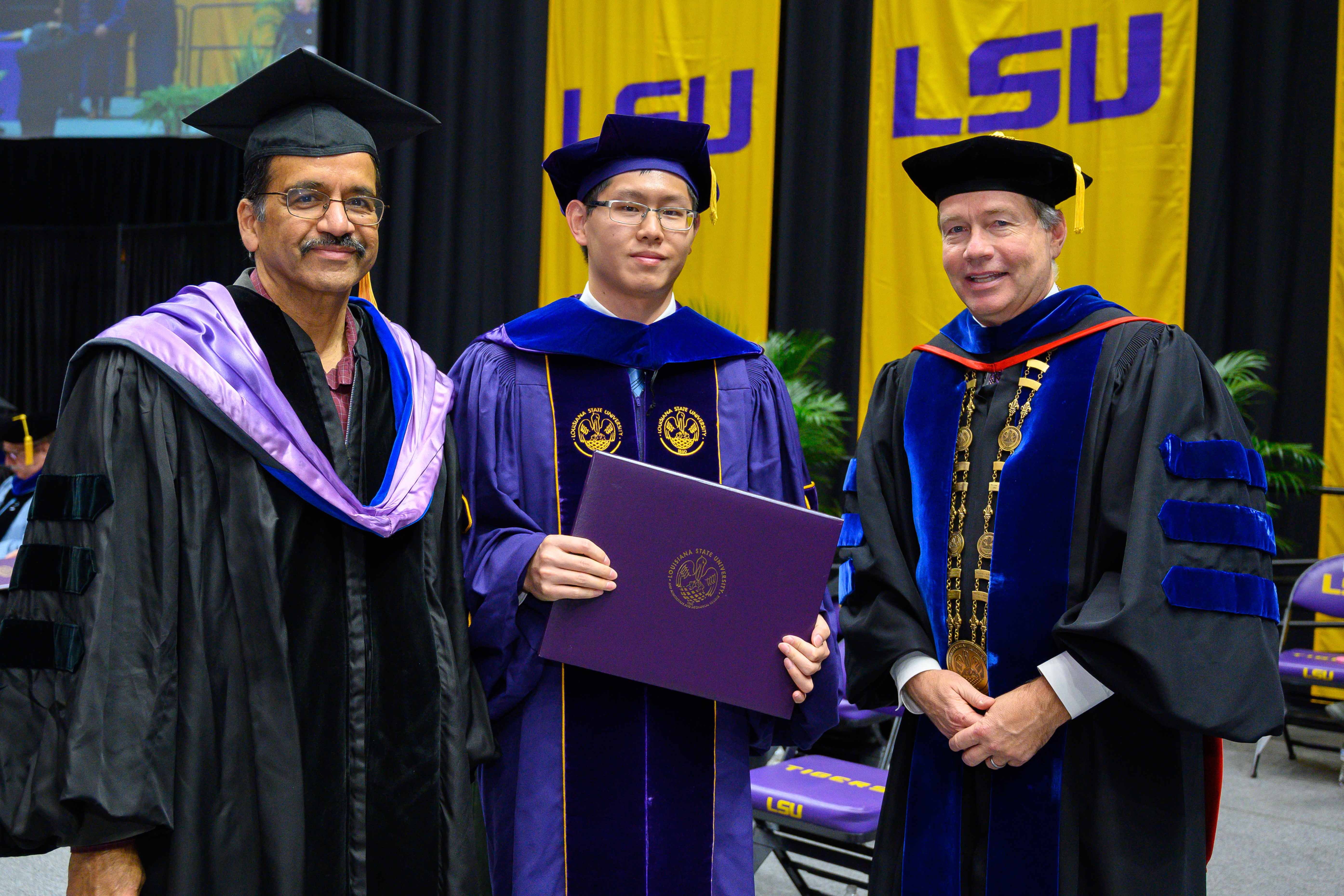 Photo of Jielin Yu, Prof. K. Nandakumar, and President Alexander