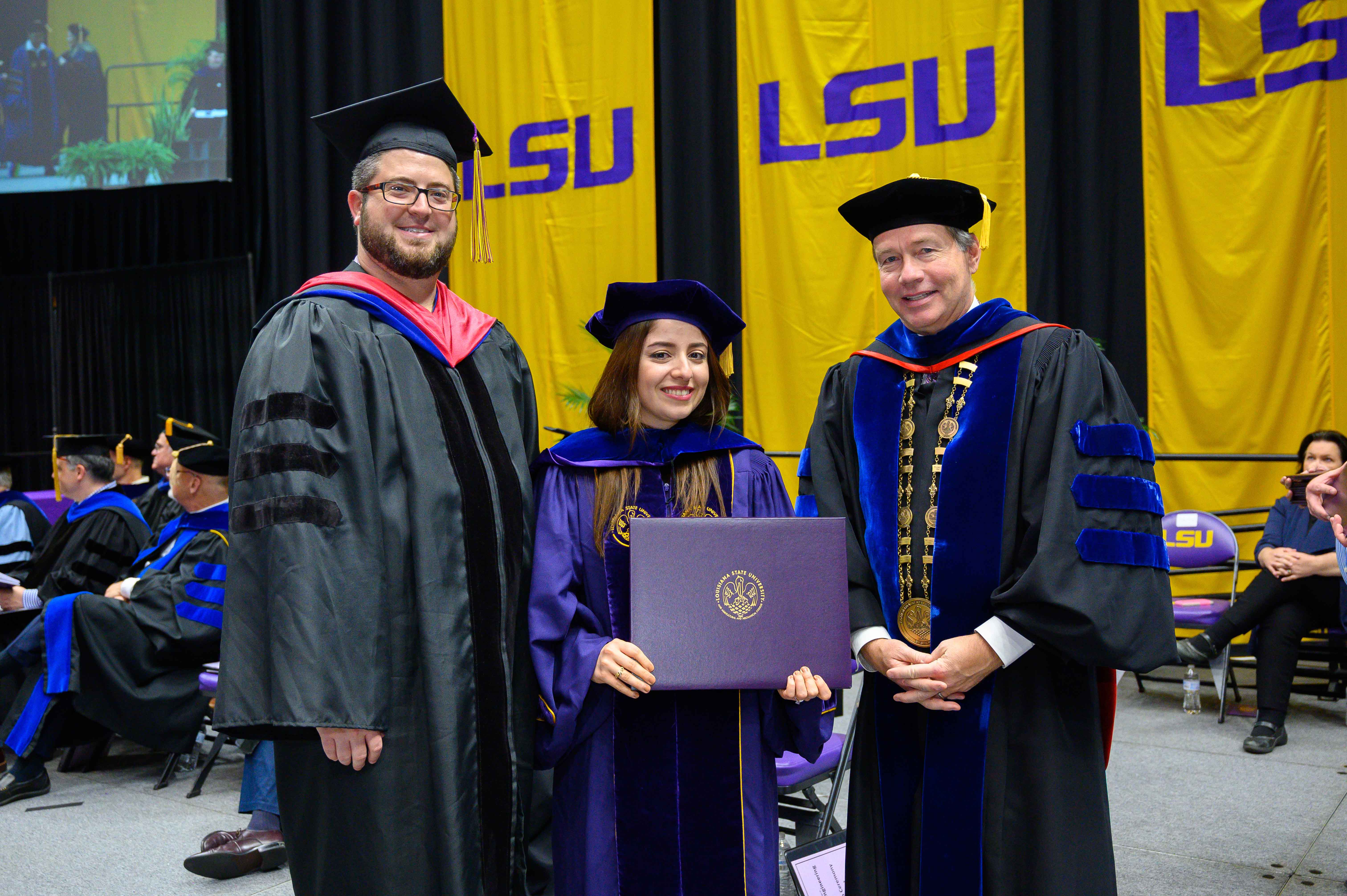 Photo of Nora Safabakhsh, Prof. Adam Melvin, and President Alexander