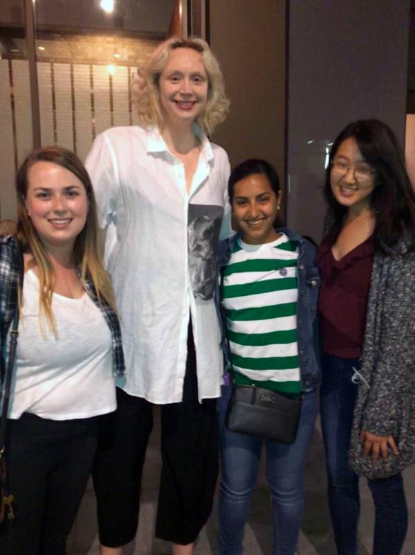 Gwendolyn Christie poses with three female students