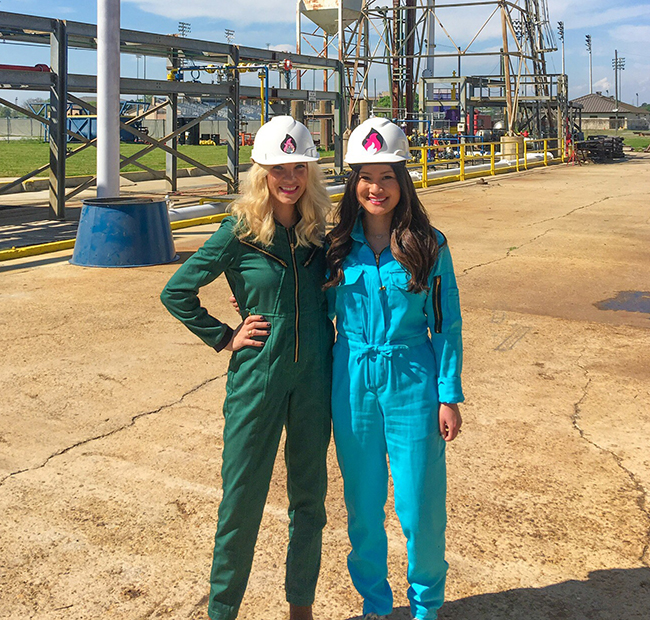 Two ladies in the hautewear safety gear posing at a work site.