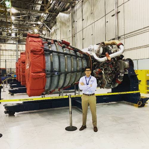 Alex Cagnola inside hangar standing in front of Rocket