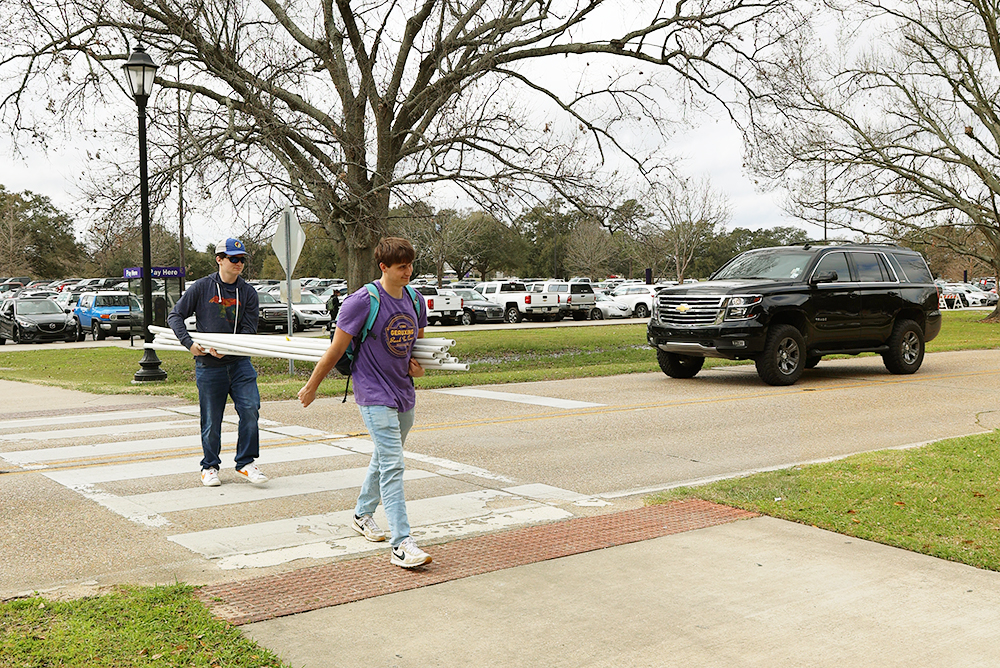 Students using crosswalk while truck is stopped