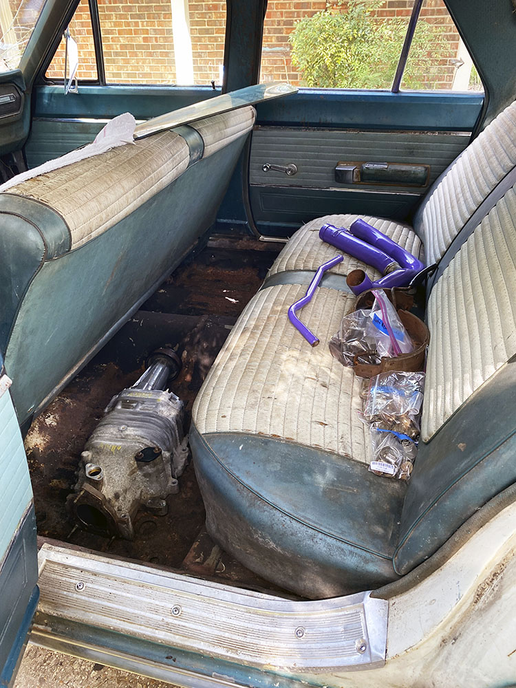 The withered back seat and floorboard of the Dodge Coronet