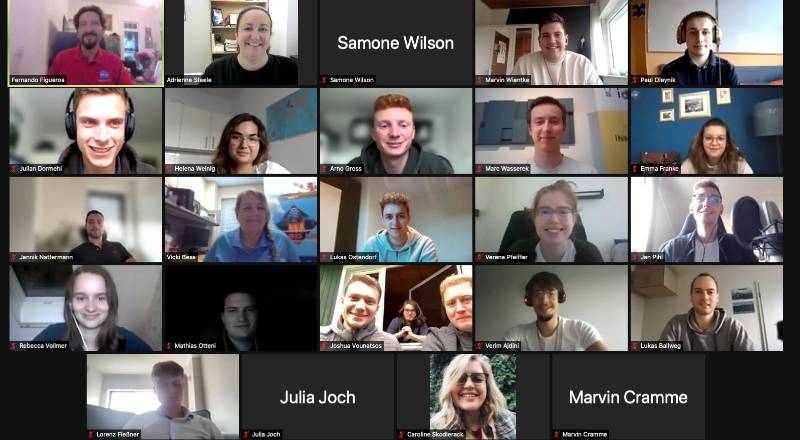 Group photo of screenshot from Zoom of people meeting