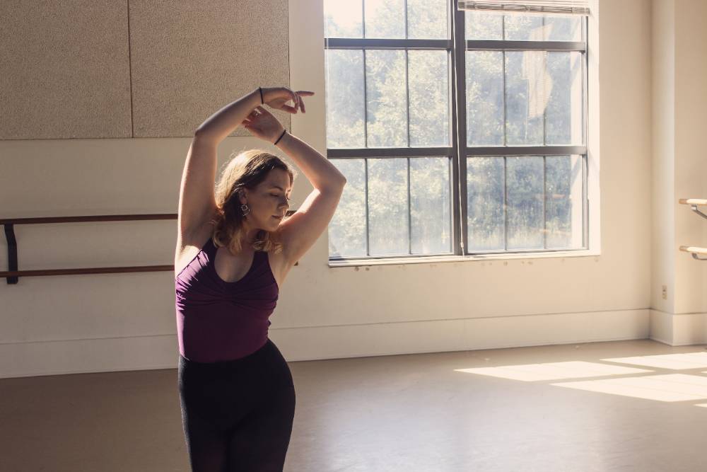 Sophia Greenwood posing in dance studio.