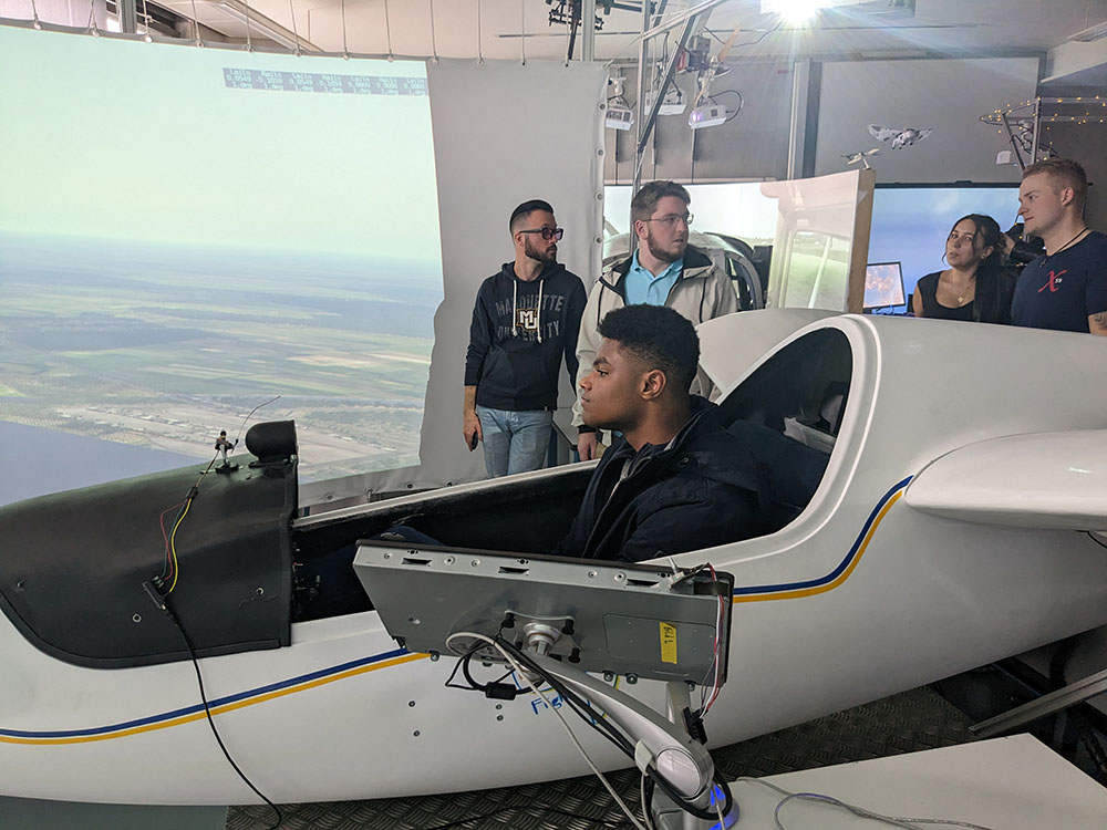 Students try out the advanced flight simulator lab
