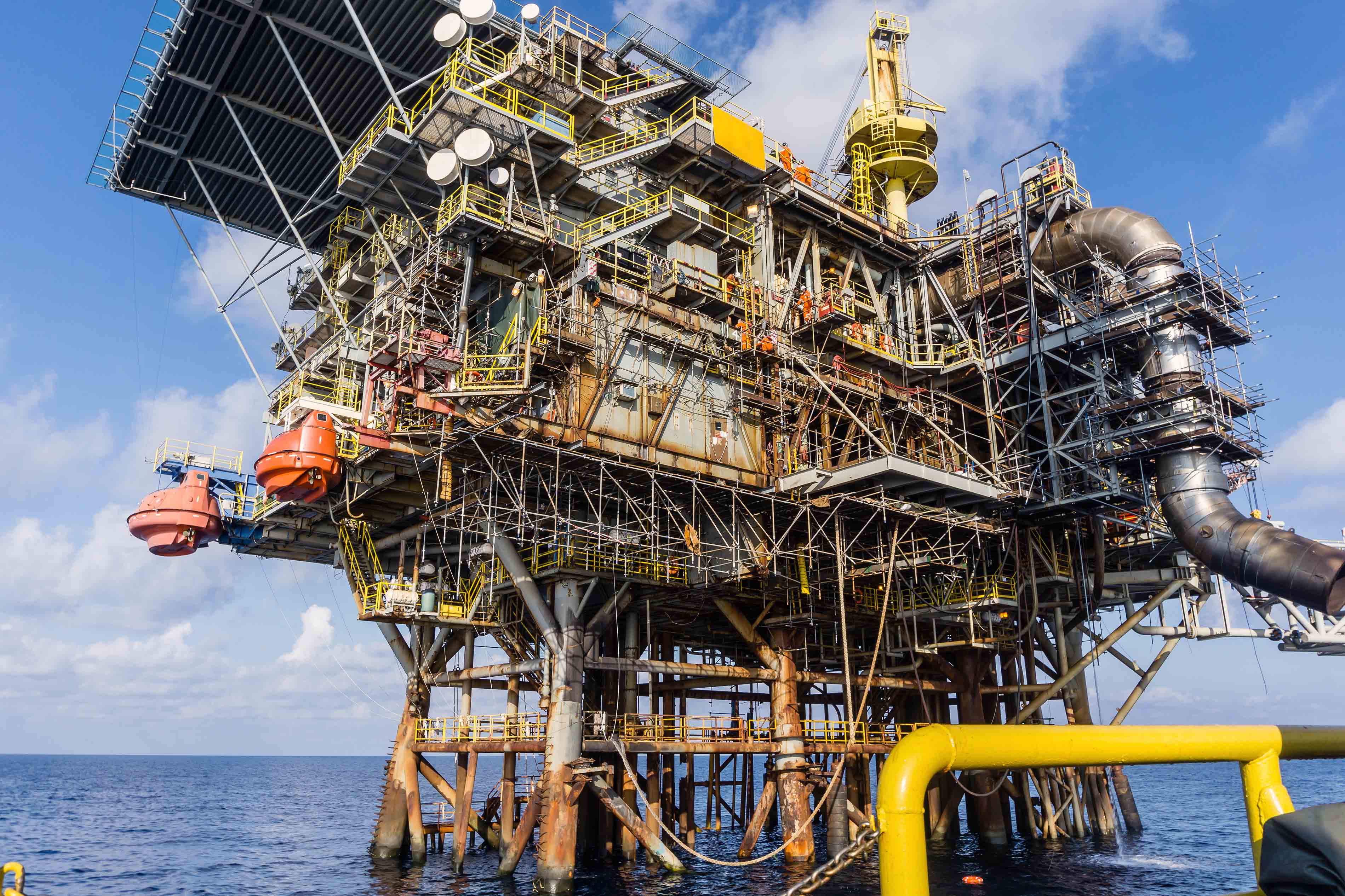 Image of aging oil rig in middle of Gulf of Mexico