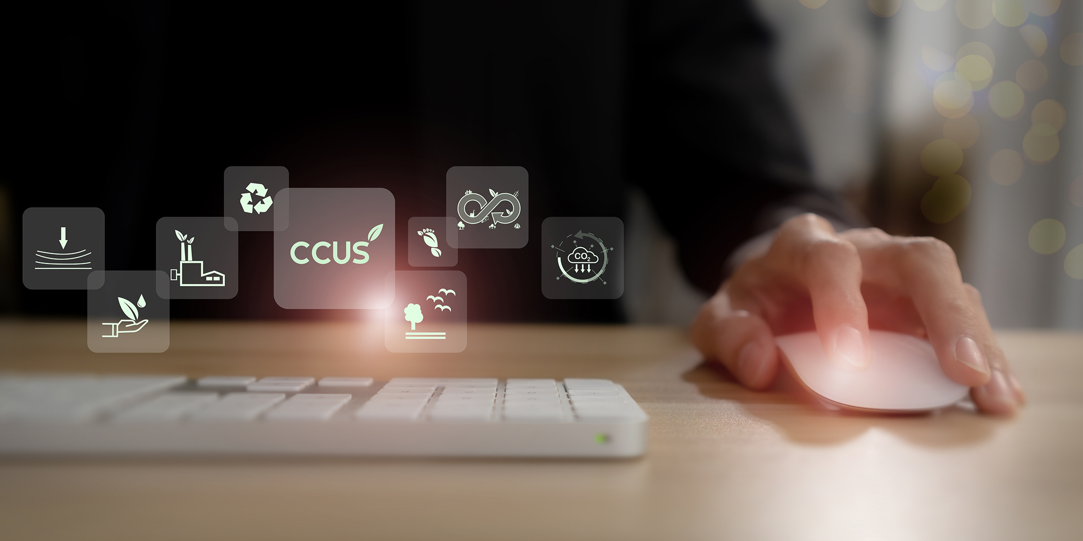 Stock image of man at keyboard with CCUS graphic