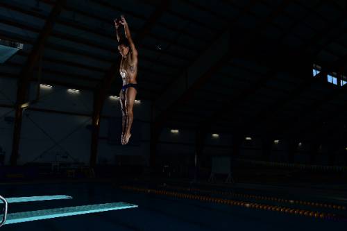 Juan jumping on diving board