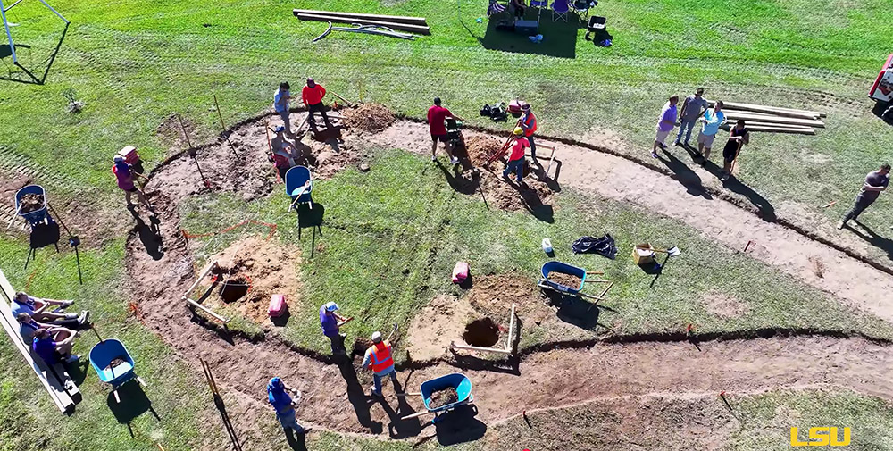 Overhead view of sidewalk being dug
