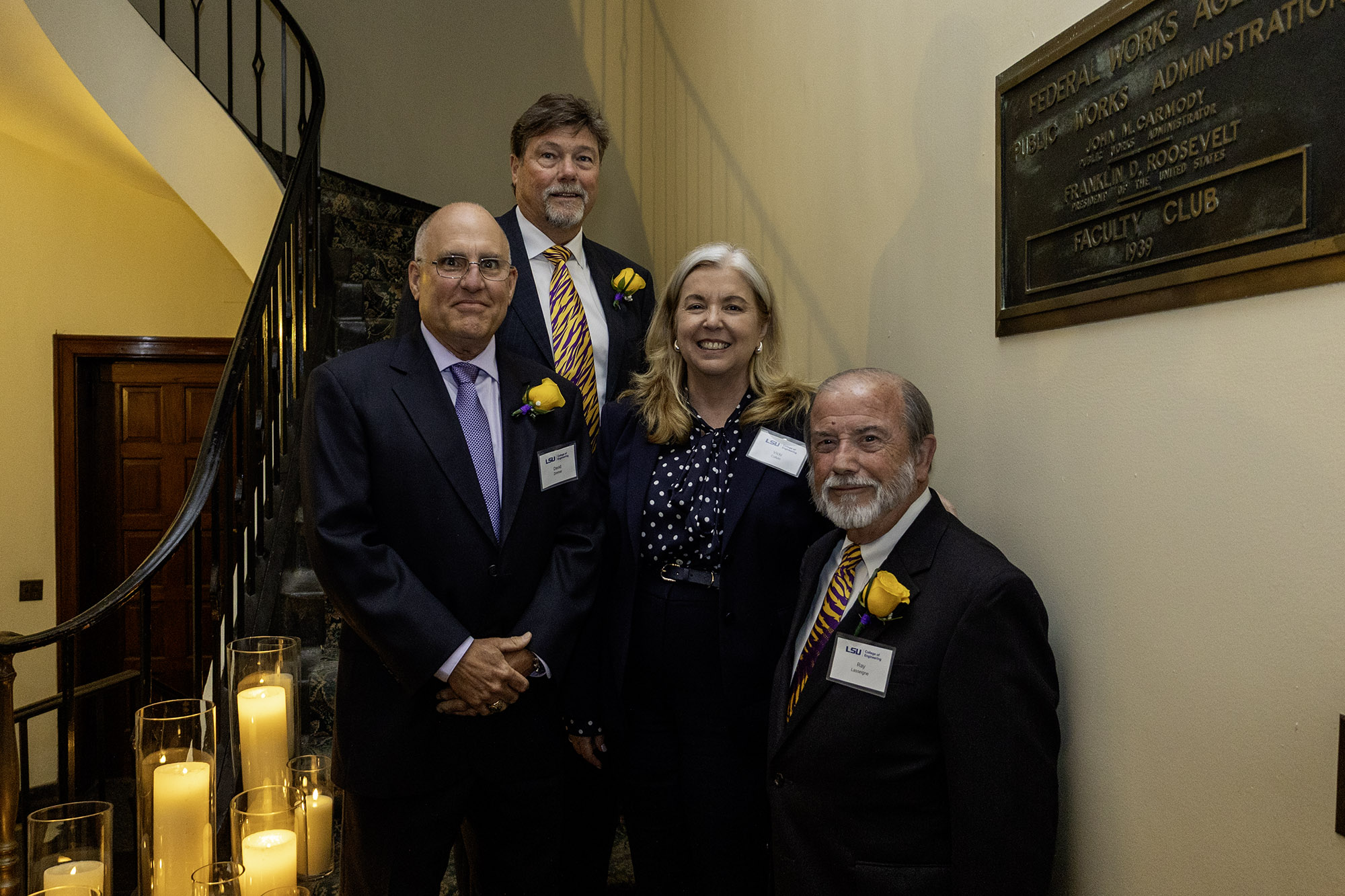 The Hall of Distinction inductees stand with Dean Vicki Colvin