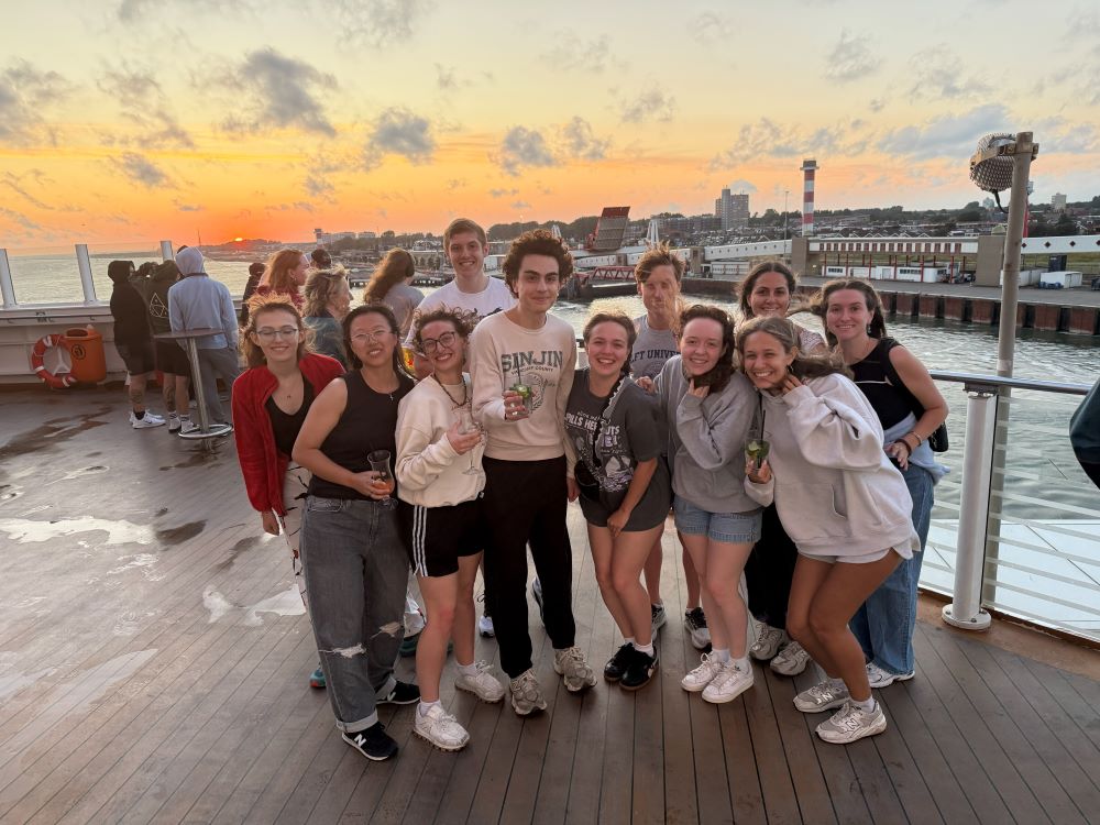 Students group photo at sunset