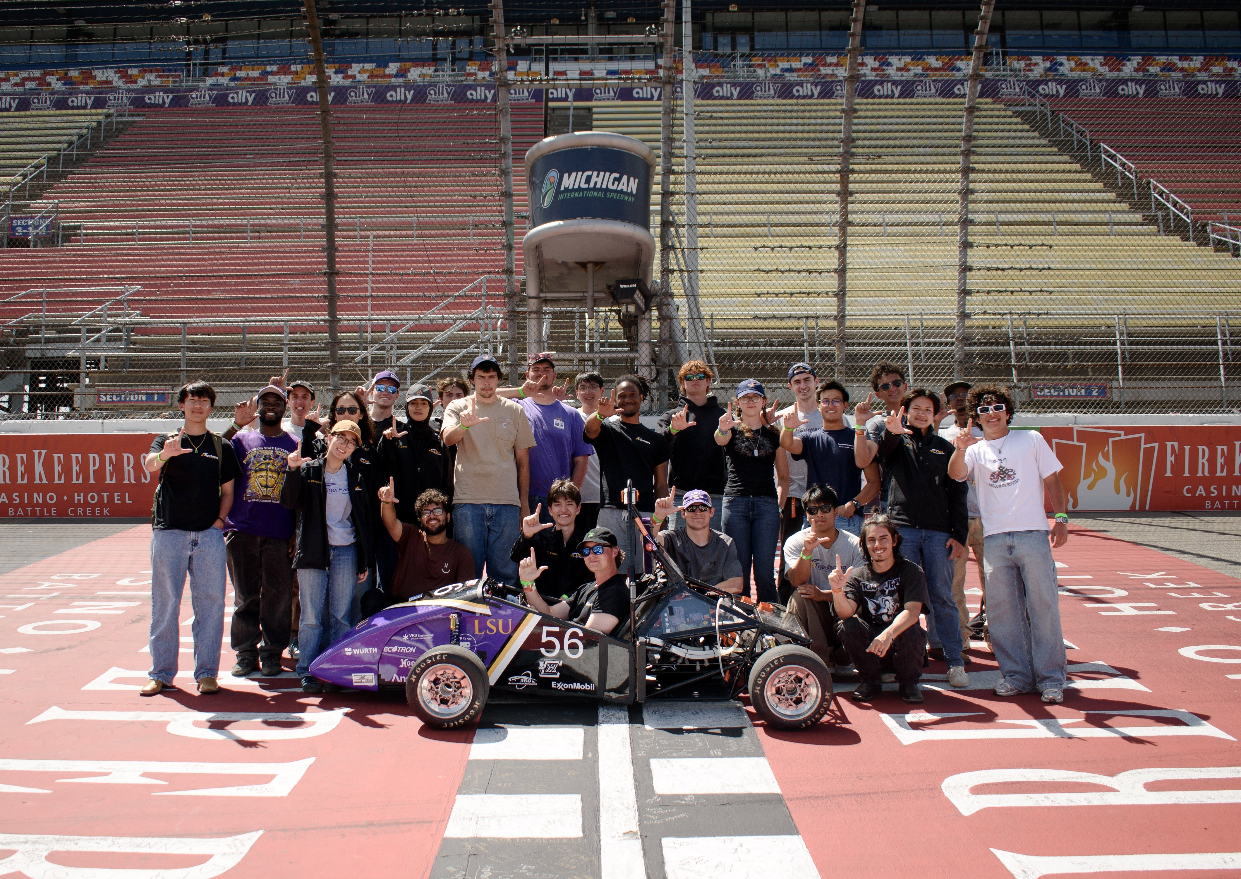 Tiger Racing Team group shot with EV car