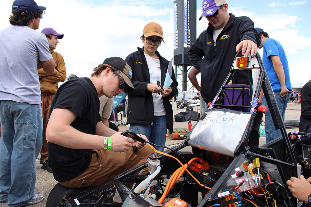 FSAE members work on the car