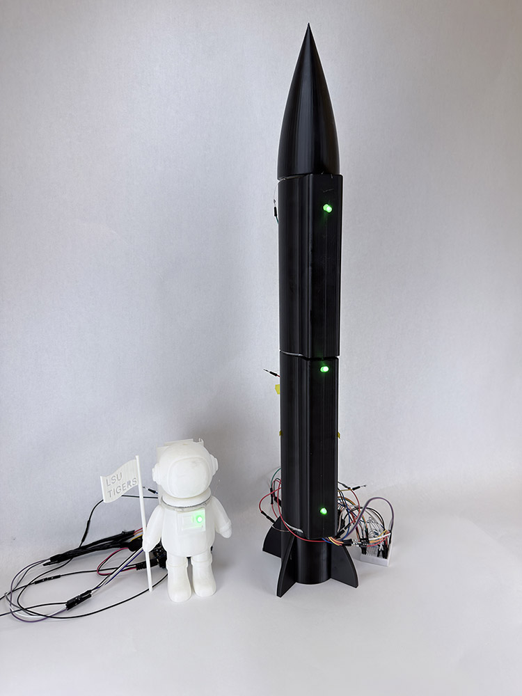 Small test rocket and space man with seals