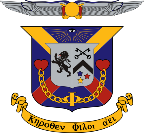 DKE crest showing a lion, key, and 3 stars in crimson, blue, and gold