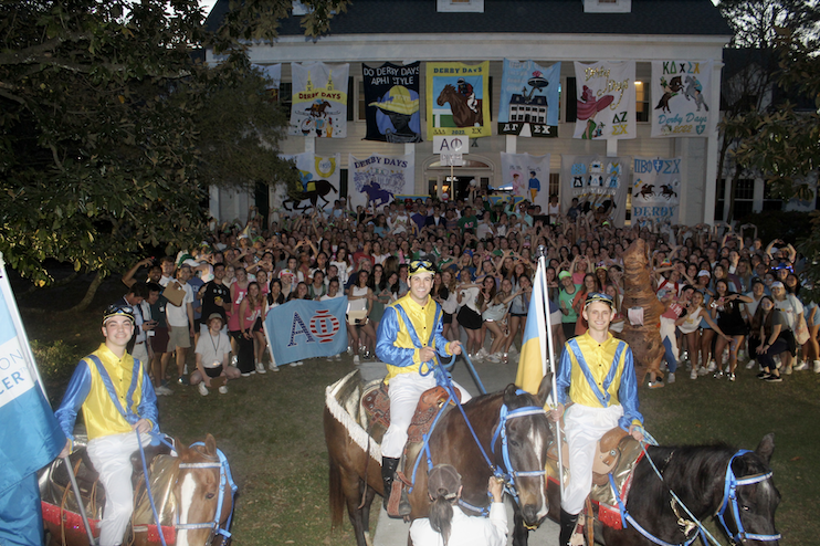 sigma chi members on horses at Derby Days event