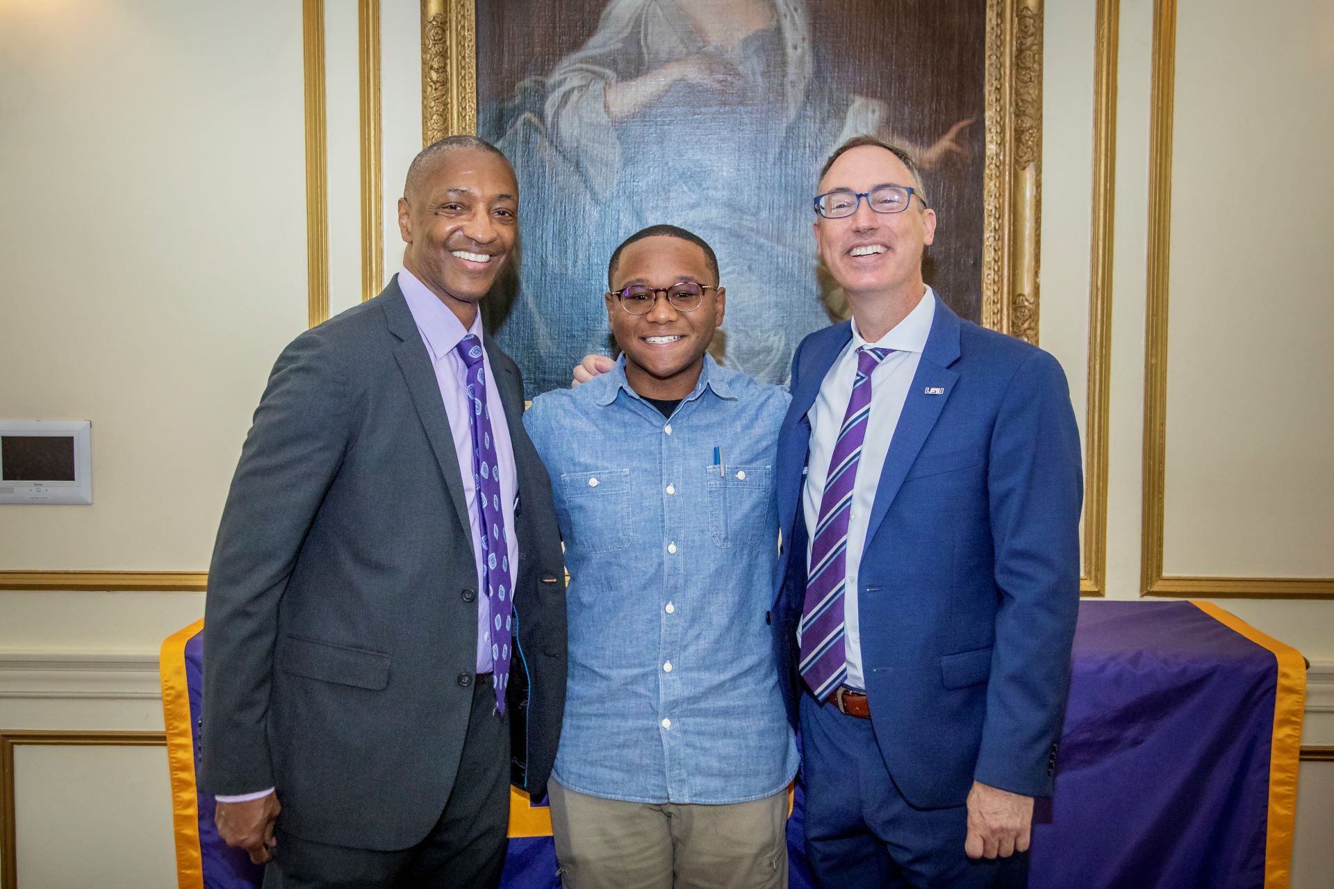 Left to right: President Tate, Tay Moore, Dean Jonathan Earle
