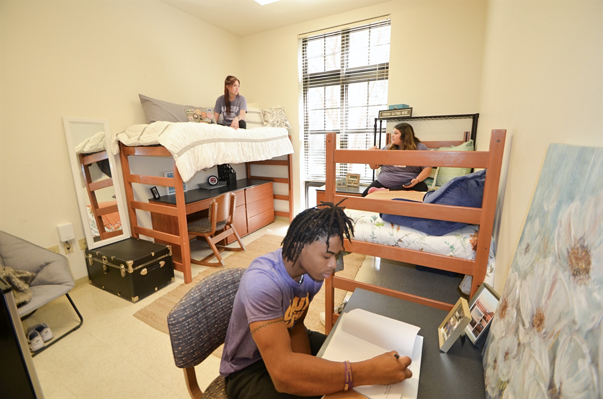 students in a residential college complex room