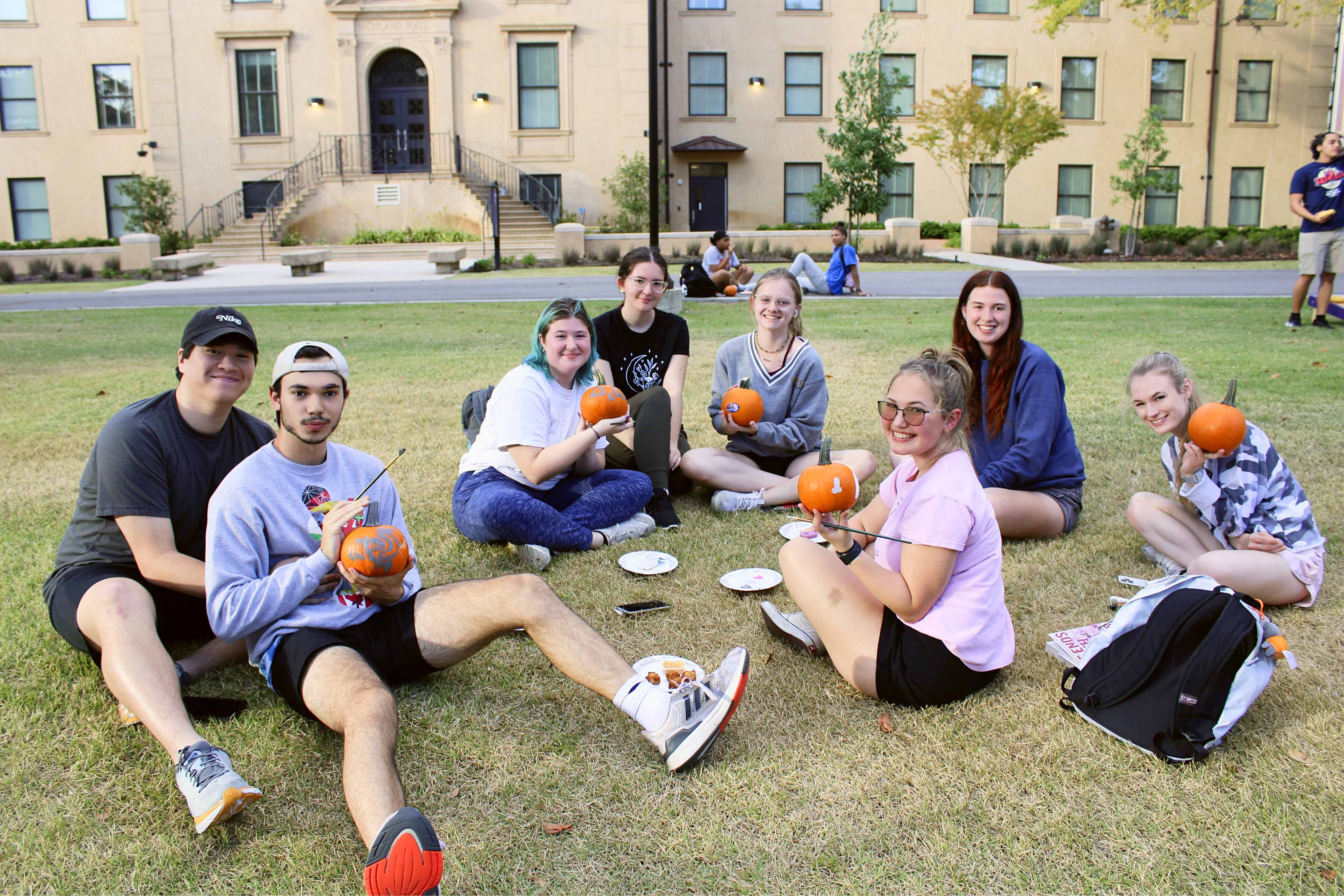 Residents painting pumpkins infront of Highland Hall.