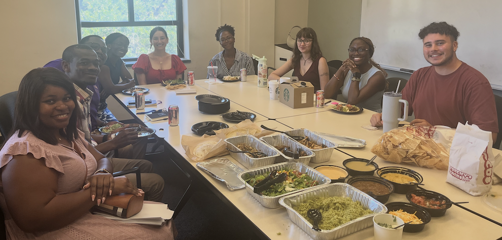 Current and new Department of French Studies Graduate Students enjoying a taco lunch during the departmental new graduate student orientation