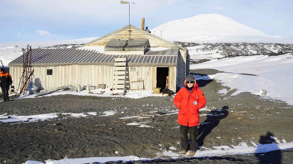 Dr. Suchy stands outside of the McMurdo station in Antarctica.