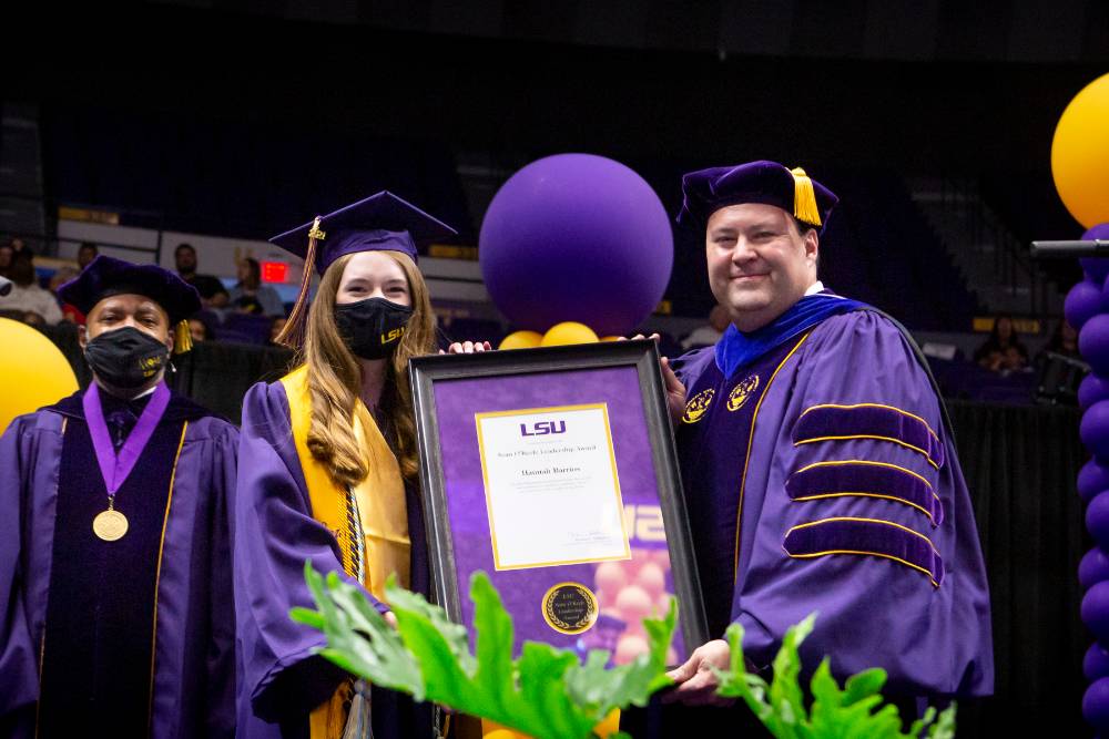 LSU graduate Hannah Barrios receives the Sean O'Keefe Leadership Award at the 2021 HSS commencement ceremony