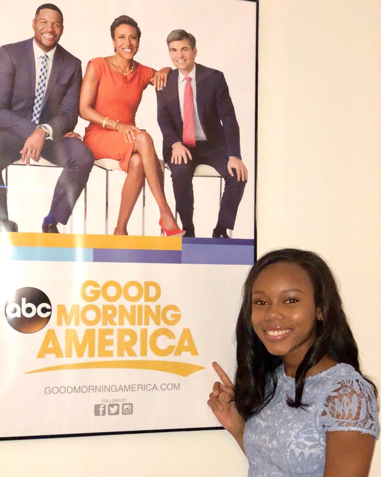 LSU student Kennedi Walker poses next to a poster for the television show "Good Morning America."