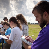 Students take notes during forensic anthropology class.