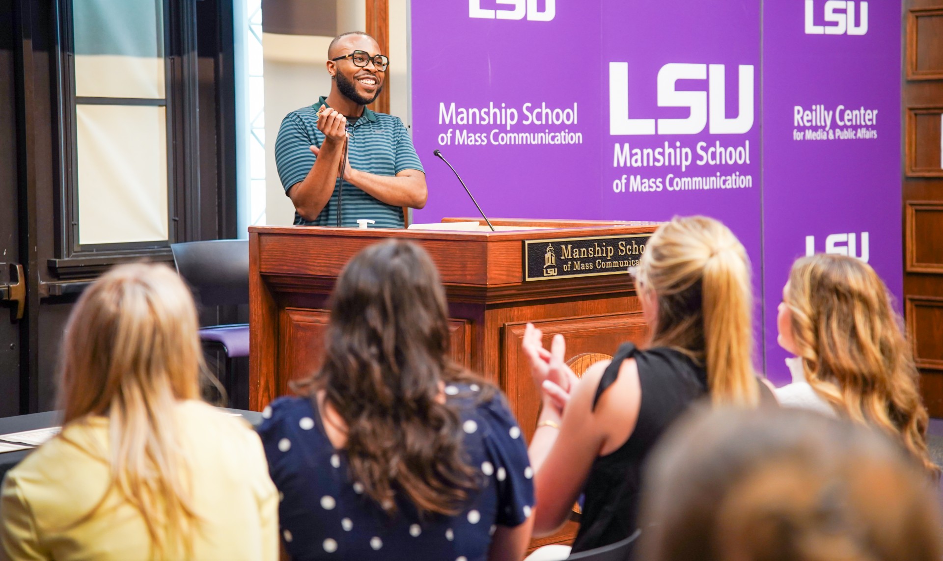 Kyrin Lewis talking to students in the Holliday Forum of the Journalism Building