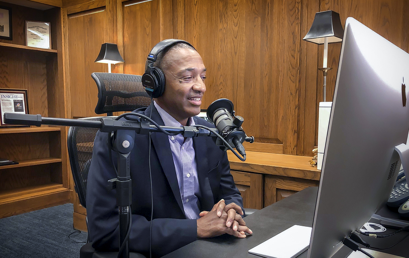 President Tate recording episode of podcast.