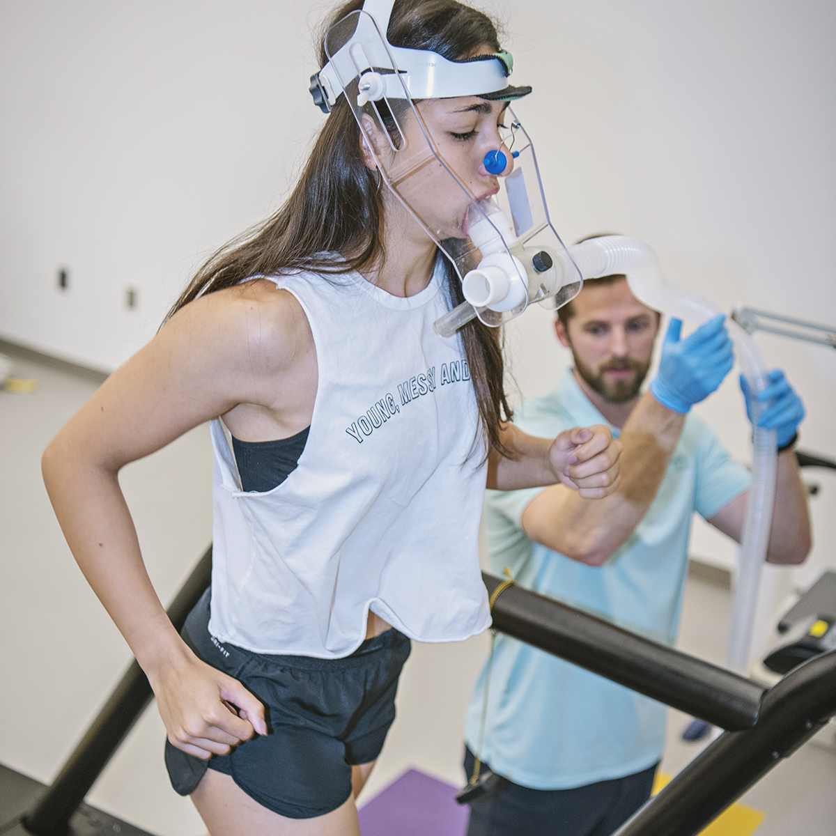 Cory Coehoorn helps student experience the VO2 Max machine