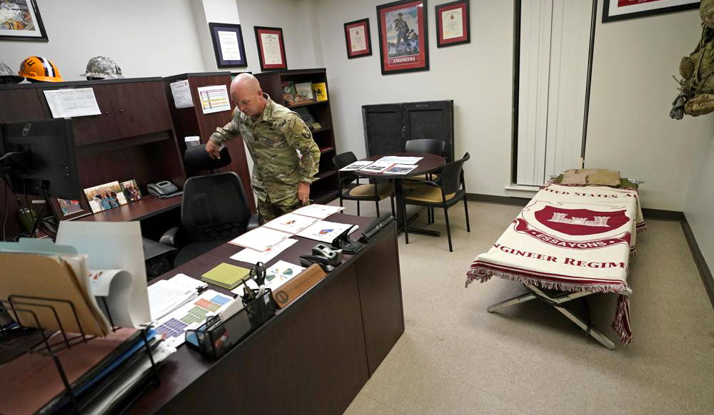 AP photo of Captain Michael Switzer in his office