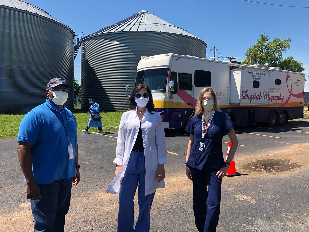 Willie White, III, CEO, David Raines Community Health Center; Dr. Jennifer Singh and Megan McDaniel of Partners in Wellness at a mobile testing location in Gilliam, Louisiana