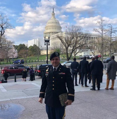 U.S. Army Maj. Gustavo Ferreira, in uniform, near the U.S. Capitol building in Washington D.C.