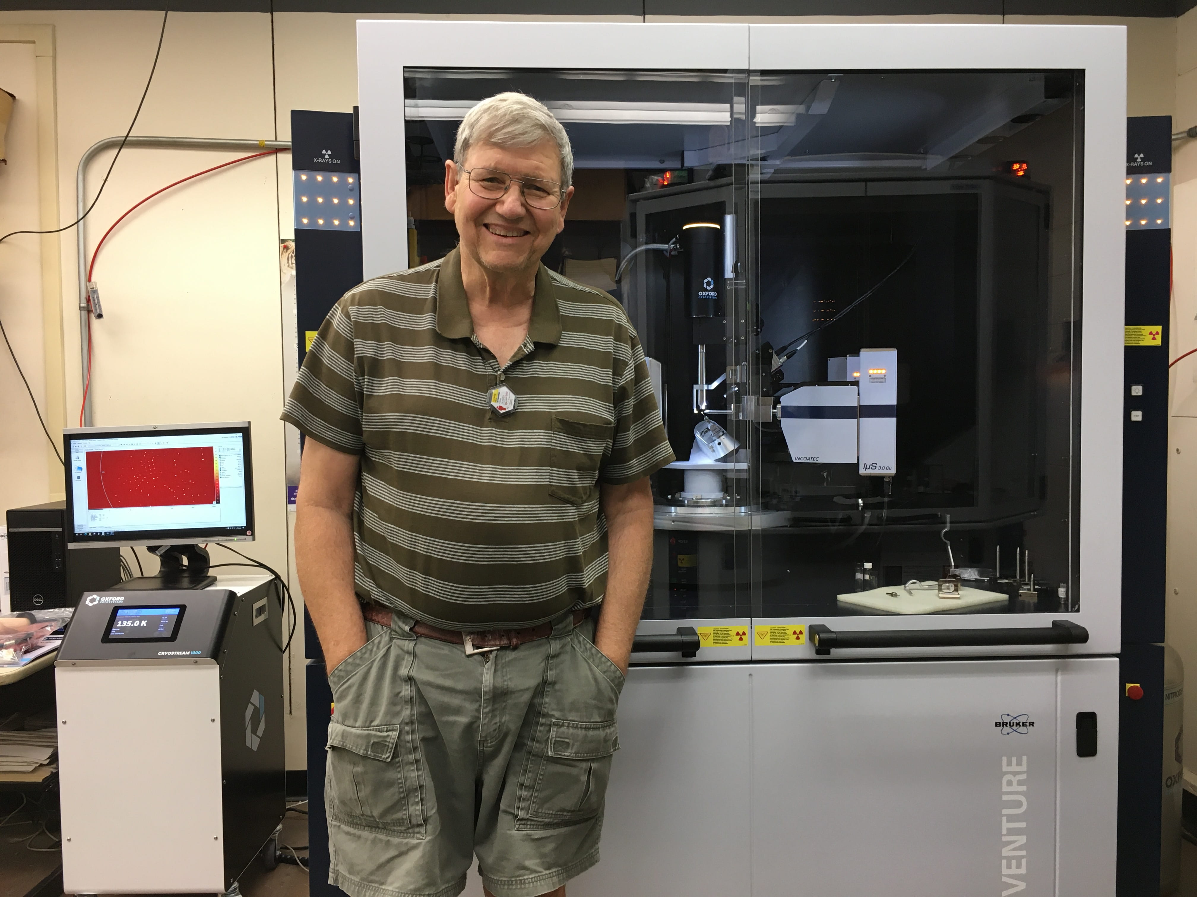 Frank Fronczek beside the D8 Venture X-ray diffractometer, used to determine the atomic structures of crystalline materials.