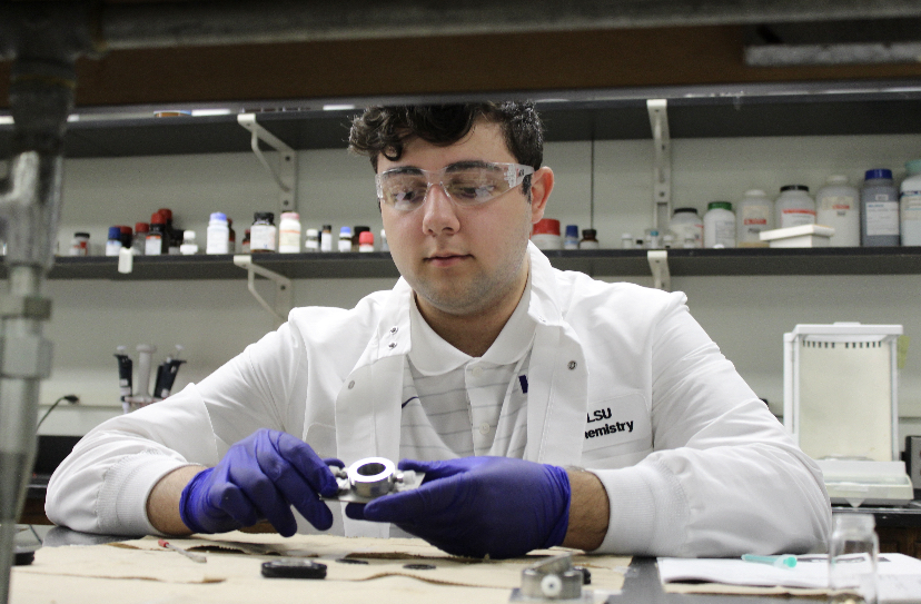 Christian Foti conducting research in the lab