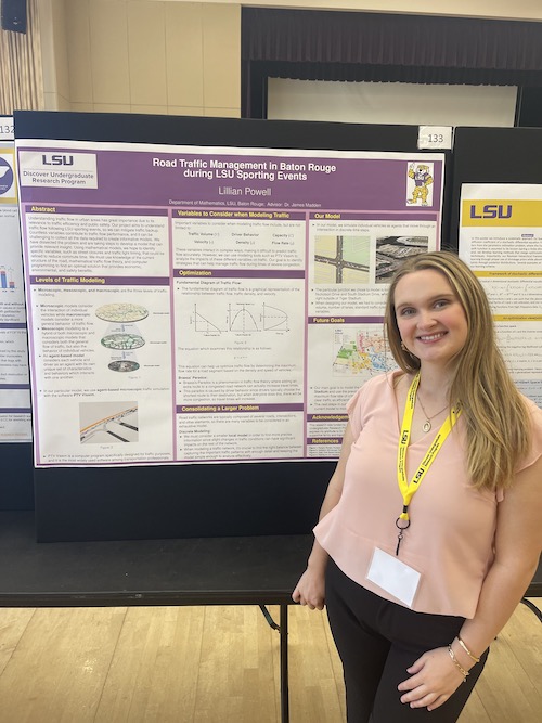 Powell standing next to her poster presentation at LSU Discover Day in the LSU Union during the Spring 2023 semester.