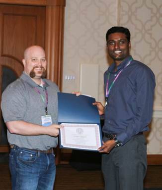 Dr. Sridhar Jaligama receiving the Society of Toxicology Postdoctoral Travel Award from Senior Councilor James Roede (University of Colorado).
