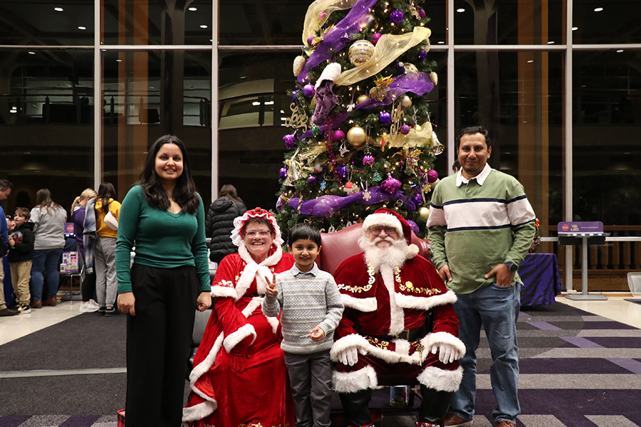 family with Santa and Mrs. Claus