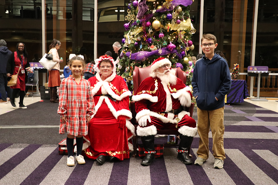 children with Santa and Mrs. Claus