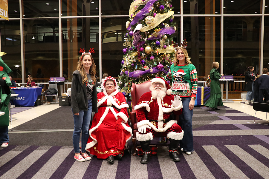 staff with Santa and Mrs. Claus