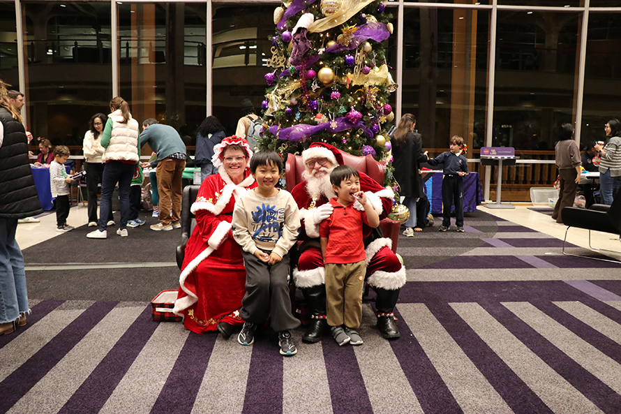 children with Santa and Mrs. Claus